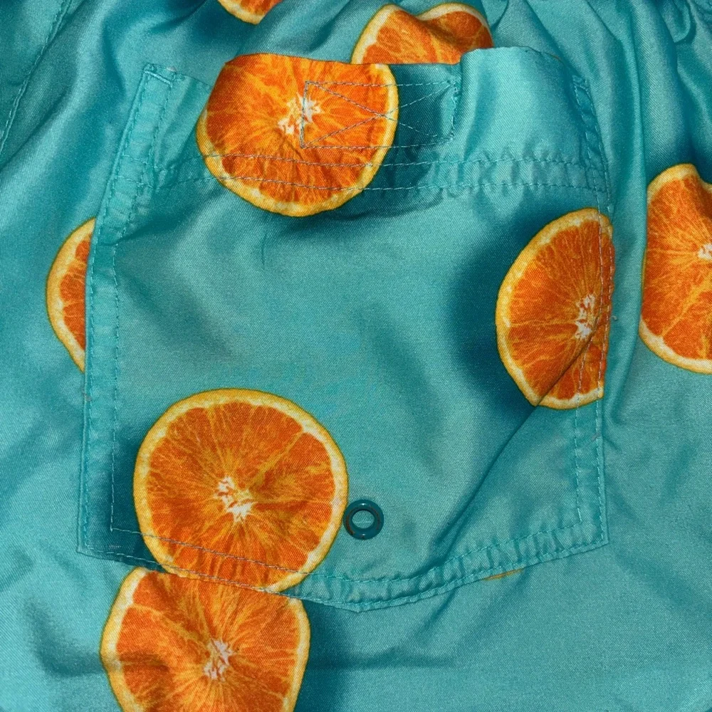 Old Navy Turquoise Swim Trunks with Orange Slice Print